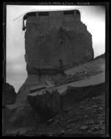 View from below, looking up at center portion of St. Francis Dam that remained after disaster, San Francesquito Canyon (Calif.), 1928