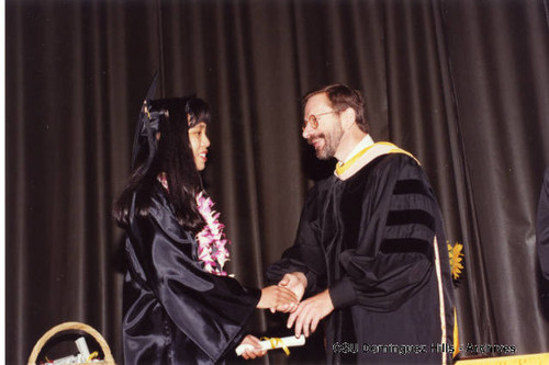 Laurence Press congratulating student at Honors Convocation