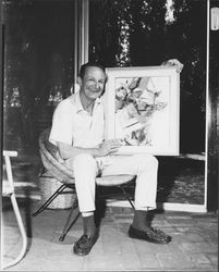 Don Meacham holding a painting, Santa Rosa, California, 1966