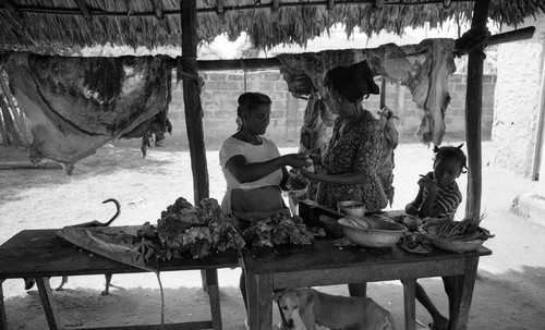 Women selling and buying meat, San Basilio de Palenque, 1976