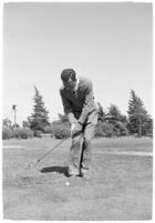 Golfer Fay Coleman demonstrates a series of "right" and "wrong" golf swings