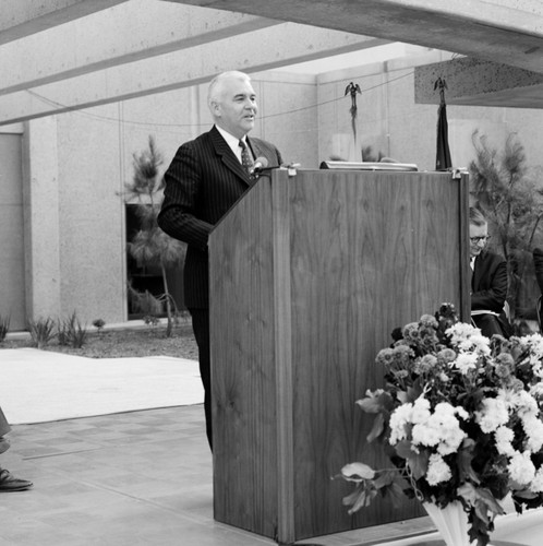 UCSD Chancellor William J. (William James) McGill at podium during dedication of UCSD Basic Science building. November 24, 1969