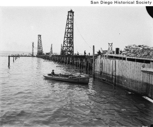 Construction workers building the municipal wharf in downtown San Diego