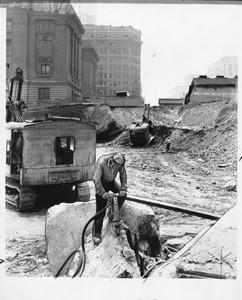 Steamshovels and jackhammers are kept busy where the new $7,280,000 Federal Building and Post Office will stand, 1937