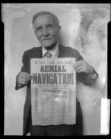 Will W. Beach holding handbill advertising 1894 San Francisco flying stunt, 1927