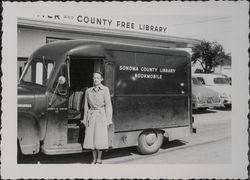 Miss Frances Murphy with the bookmobile