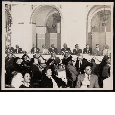 Banquet (left-right): Col. Leopold Phillips, Frank Crosswaith, Police Commissioner O'Brien, Robert Wagner Jr., A. Philip Randolph, Grover Whalen, Mayor Vincent Impellitteri, Maurice Tobin, A. Ralph Bunche, Ashley L. Totten