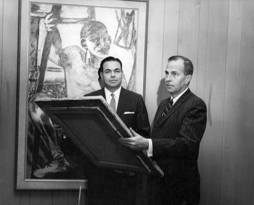 David May II, left, exhibits company's collection