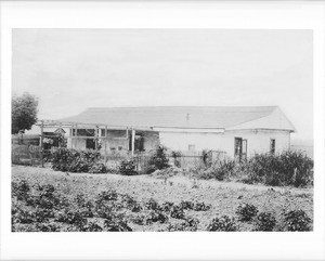 Exterior view of the Casa de Don Delores Sepulveda from the front with garden, ca.1884