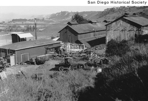 Barns, sheds, and automobiles at the Allen Dairy in Mission Valley