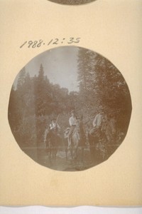[Three men on horseback]