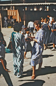 Missionary and Teacher Thyra Smidt in conversation with a coworker at the International School