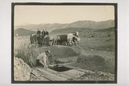 We arrive at Owl Springs, here an abandoned water wagon was found the front wheels sunk in sand, the rear ones almost all cut away by desert wanderers for fire wood; Owl Springs--one of the water holes of the twenty mule team borax days