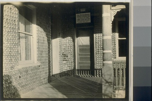 After seeing the town house we went back to the depot got in our machines and drove back to the Bottle House where we spent the night; the front porch of the Bottle House