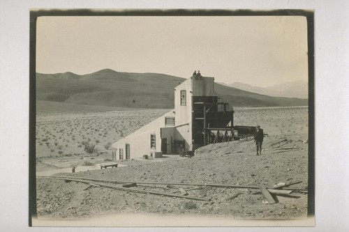 We pass Ashford mills--A deserted hope--Thousands of dollars of equipment left here. This mill was of the roller type and the building has a 75 horsepower engine in it in the foreground out of sight of the cameras eye is a big truck the rubber slowly rotting away. Mr Billyon and A. E. Dimock sitting on top; Ashford Mills