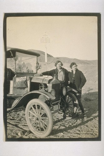 What the sign said: Owl Springs--Death Valley--Saratoga Springs 45 m, Silver Lake 42, Shoshone 5, Automobile Club, So. Cal.; Meet Mrs.Perrelet and Miss Muth