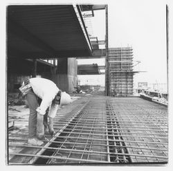 Construction worker clipping forms for the second floor in the new Exchange Bank building, 545 Fourth Street, Santa Rosa, California, 1971