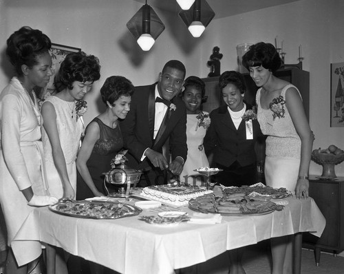 Senator Bill Greene cutting cake, Los Angeles, 1966