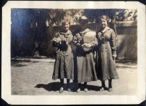 Three young women in school uniform