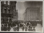 [Street scene of crowd watching fire on Battery St. From Market St. Donahue Labor monument, right]