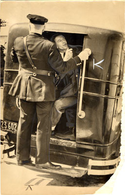 [Police arresting disturber during the 1937 WPA strike]