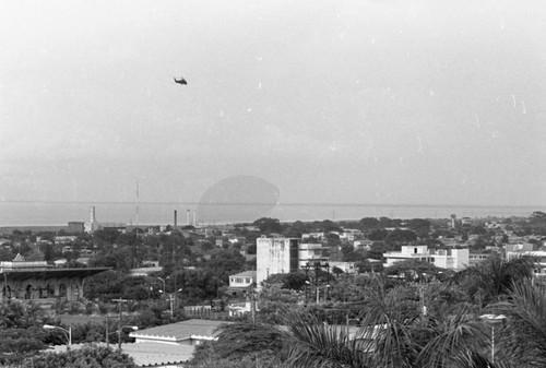 Helicopter over a city, Nicaragua, 1979