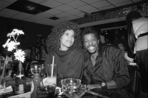 Jackée Harry sitting with Ollie "Ali" Woodson at the Pied Piper Nightclub, Los Angeles, 1987