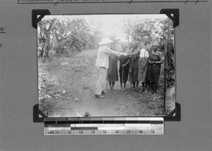 Widows greeting Missionary Ferdinand Jansa, Kyimbila, Tanzania, 1929