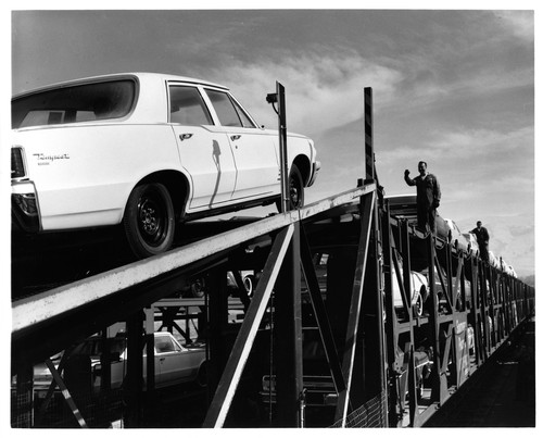 Cars Being Loaded onto a Freight Train at the Fremont GMC Plant