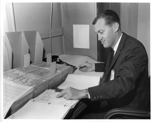 Unknown Male Analyzing Data Sets at the San Jose IBM Research Facility