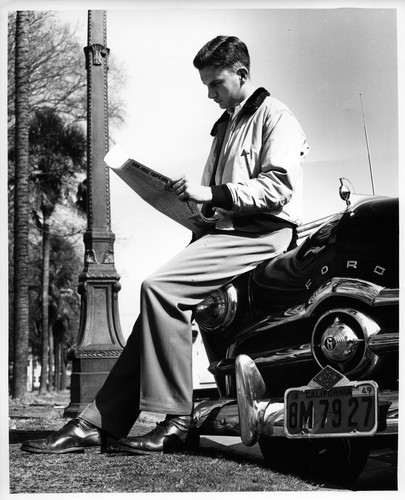 San Jose State College Student Sitting on the Hood of a Ford Automobile