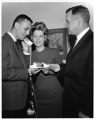 Unidentified Male on the Telephone with Female Listening In