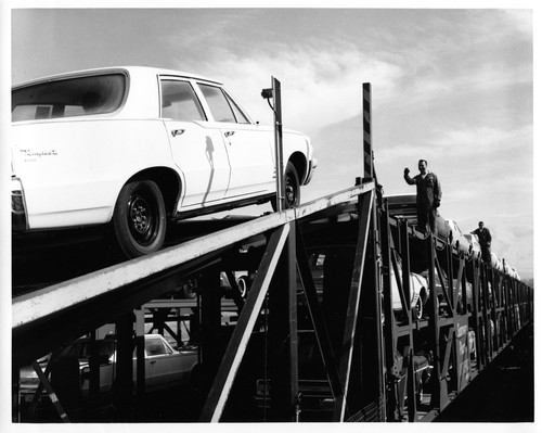 Cars Being Loaded onto a Freight Train at the Fremont GMC Plant