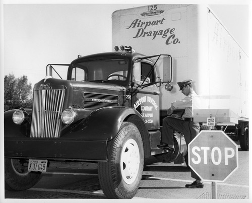 Image Showing Trucks Utilized to Transport IBM Data Processing Equipment