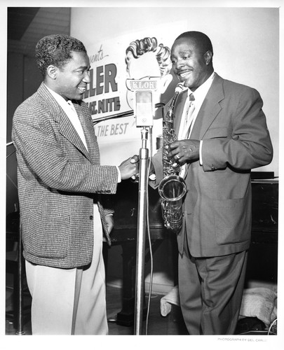 Saxophone Player Greeted by Unidentified Male During a KLOK Live Radio Show