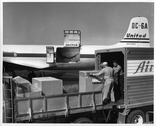 Packaged IBM Data Processing Equipment Loaded from Trucks onto Airplane