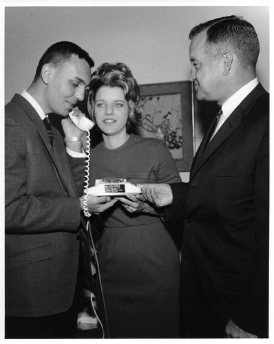 Unidentified Male on the Telephone with Female Listening In