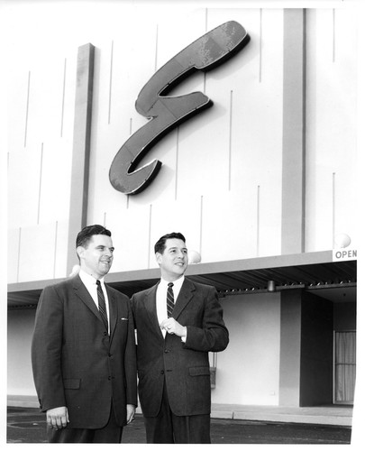 Two Gentlemen in Front of the Emporium Department Store Sign