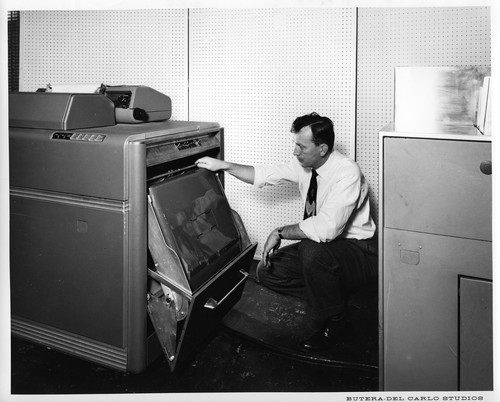 Unidentified Male Inspecting the Mechanisms of an IBM Data Processing Machine