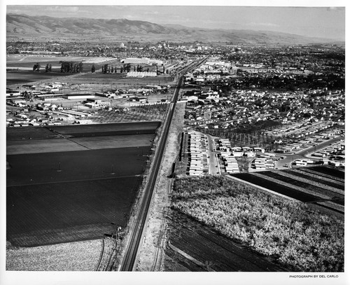 Southeast Aerial View Along Rail Road Tracks Into San Jose, CA