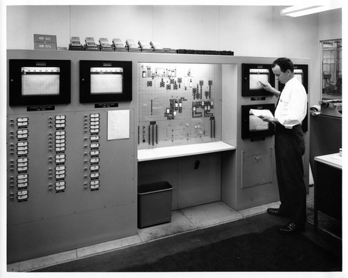 Engineer Checking Readings of Various Ovens at the Fremont GMC Assembly Plant