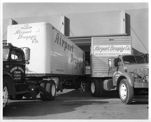 Image Showing Trucks Utilized to Transport IBM Data Processing Equipment