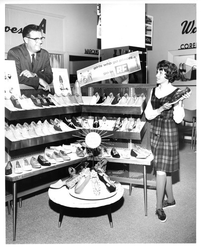 Sales Personnel Depicted with Shoe Display Inside Hart's Department Store