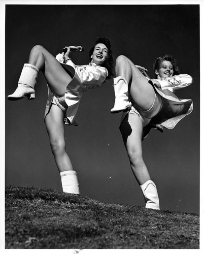 Action Shot of Two Drum Majorettes Striking a Pose