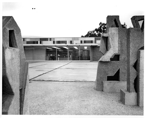 Partial View of IBM Building 25 Flanked by Stone Sculptures