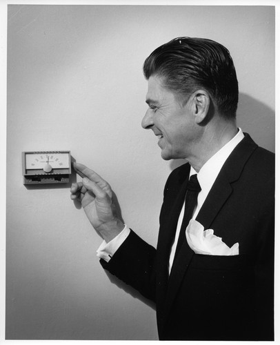 Ronald Reagan Adjusting a Wall Thermostat