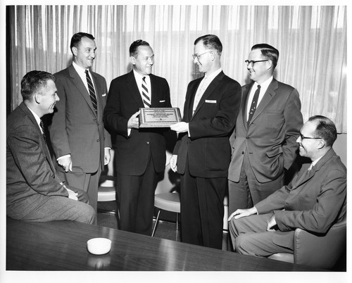 Group Portrait of IBM Businessmen During an Award of Merit Presentation