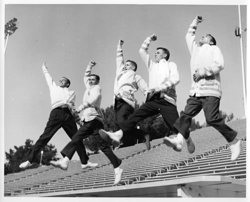 Action Shot of Five Male San Jose State College Cheerleaders