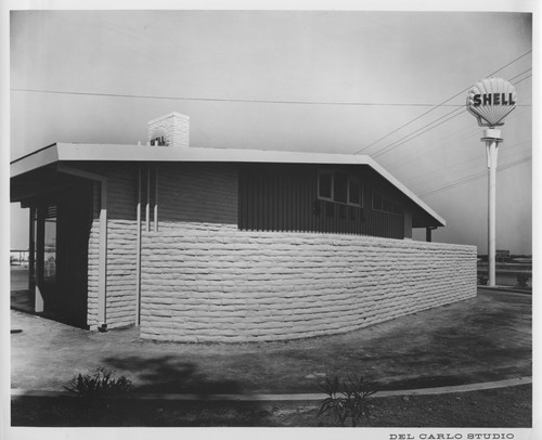 Oval Brick Wall of the Shell Gas Station Adjacent to the Mobil Country Club, Inc