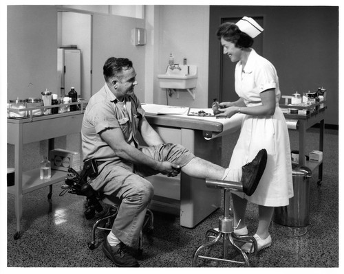 Male Receiving Medical Treatment at the GMC Assembly Plant's Health Facility